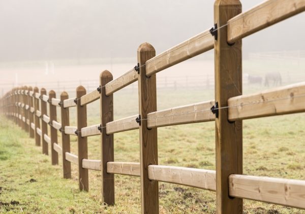 wooden fencing with two strands of electric wire